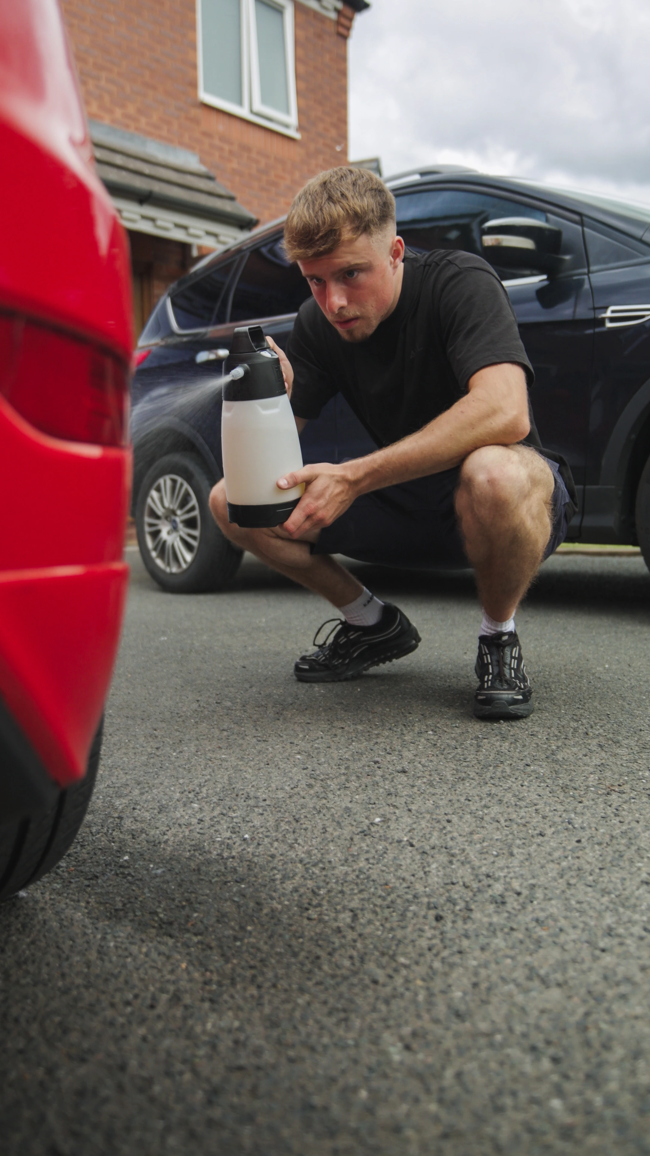 M&L Detailing team member applying careful exterior detailing