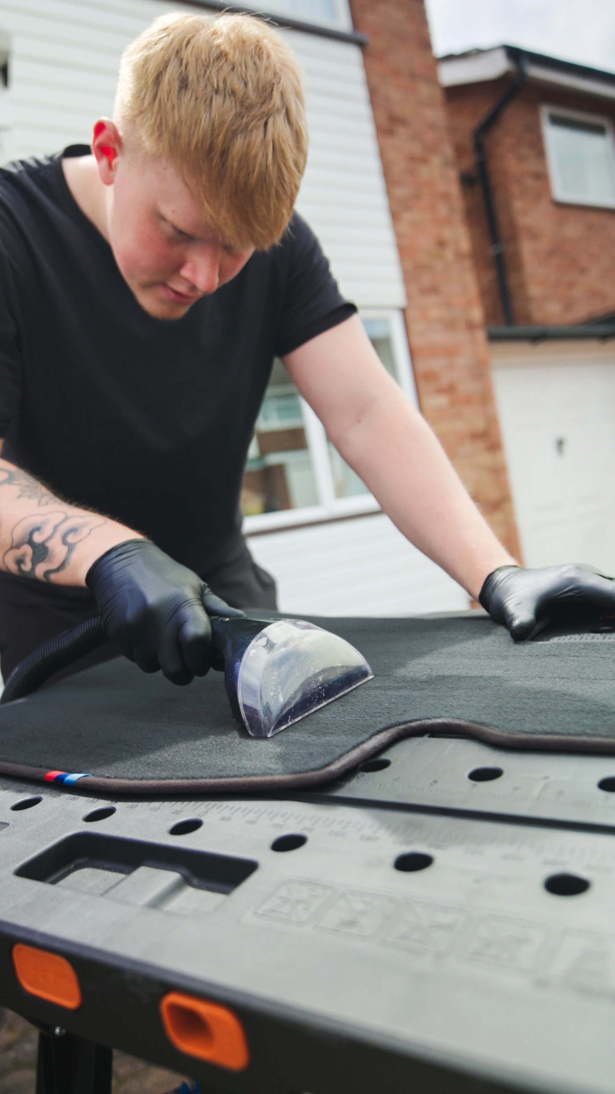 M&L Detailing team member carrying out interior cleaning work
