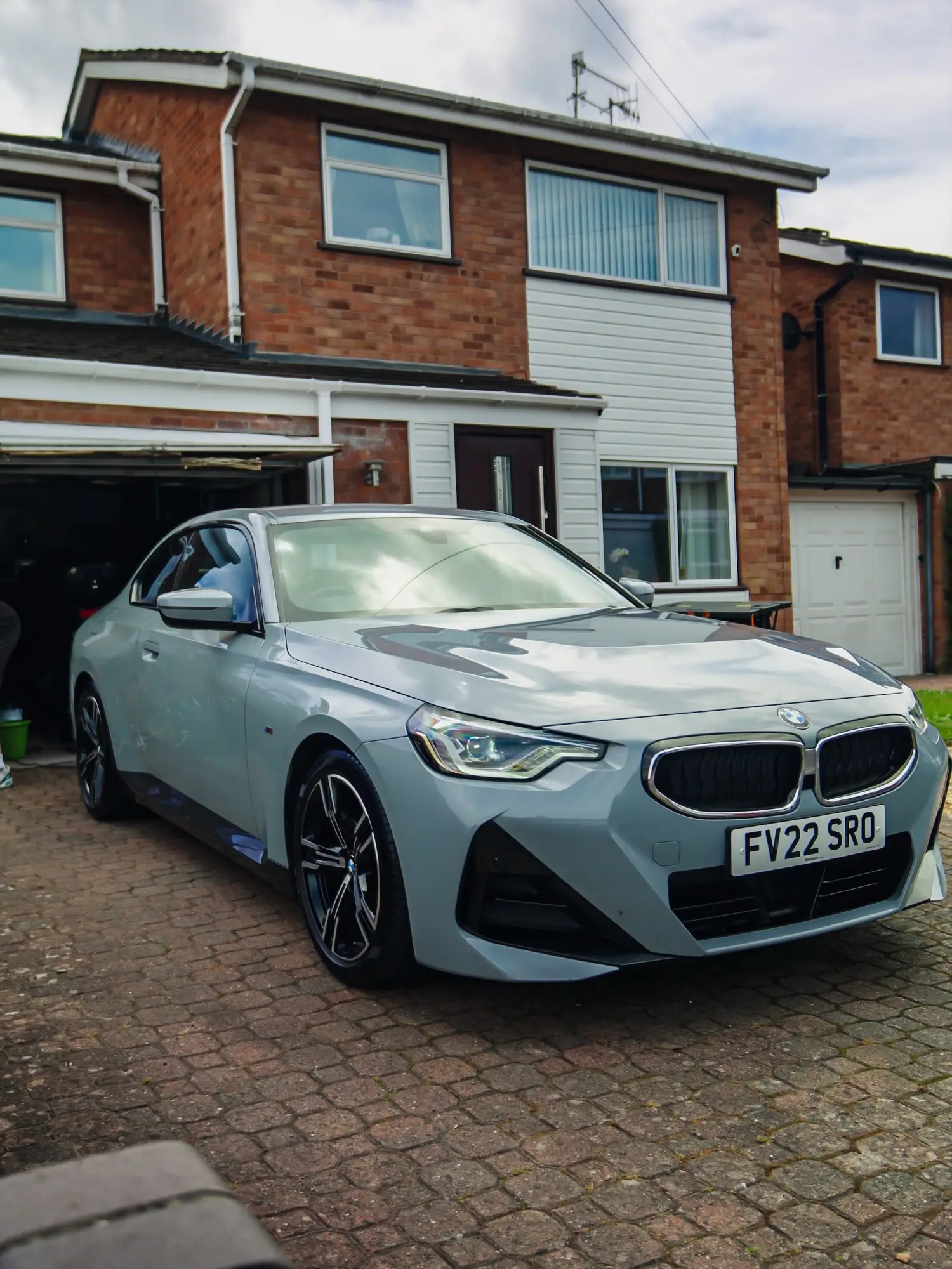 Freshly detailed BMW on a driveway after a full valet